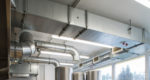 Ventilation pipe system in kitchen interior.